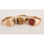 Two 9ct gold signet rings, and three other signet rings, set with hard stones, (5).