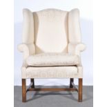 A Georgian style wing-back armchair.