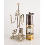 Miners lamp by Ackroyd & Best Ltd, glass decanter, a Walker & Hall plated epergne stand,