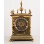 Brass mantel clock, striking on a bell, chapter ring with Arabic numerals, 28cm high.