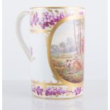 Derby style porcelain mug, painted with a stag hunting scene,