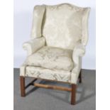 A Georgian single wing-back armchair.