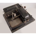 Early Mignon AEG portable typewriter in a metal case.