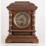 Victorian walnut mantel clock, with pendulum and key, height 29cm.