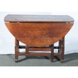 An oak gateleg table, in part early 19th century, oval top, W105cm x H67cm.