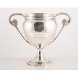 A silver two-handled pedestal trophy cup, London 1914, engraved presentation inscription.