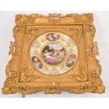 A Viennese porcelain dish, printed panels, titled "Loves Awakening", gilt borders, 24cm, gilt frame.