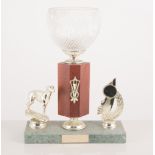 Metal greyhound trophies and others.