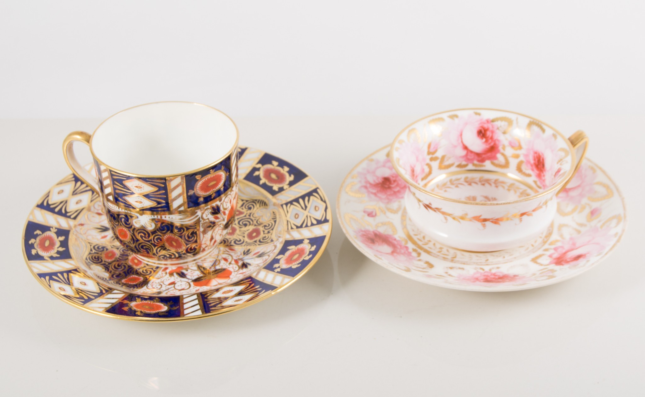 Spode cup and saucer, painted with a floral spray within an Imari style border,