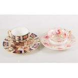 Spode cup and saucer, painted with a floral spray within an Imari style border,