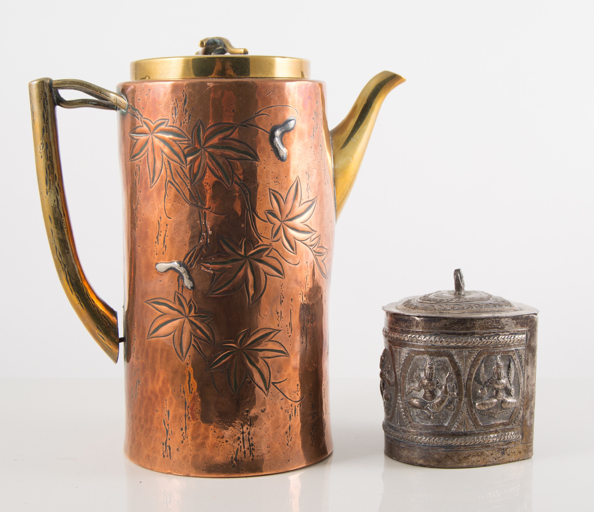 Copper and brass coffee pot, straight sided cylindrical form engraved with leaves,
