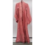 Salmon pink silk kimono, 1930s, with floral embroidered decoration, complete with sash.