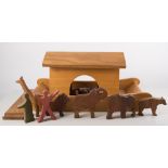 Galt wooden model of Noah's Ark, with a collection of carved wooden paired animals and birds.
