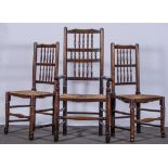 A set of eight oak and ash Lancashire type spindle-back dining chairs, rush seats,