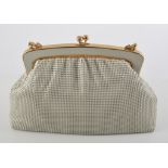 Orton Collection ivory mesh handbag and purse, with guarantee, dated 1970, (2).