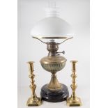 Two brass oil lamps with milk glass shades and chimneys, pair of 25cm brass candlesticks.