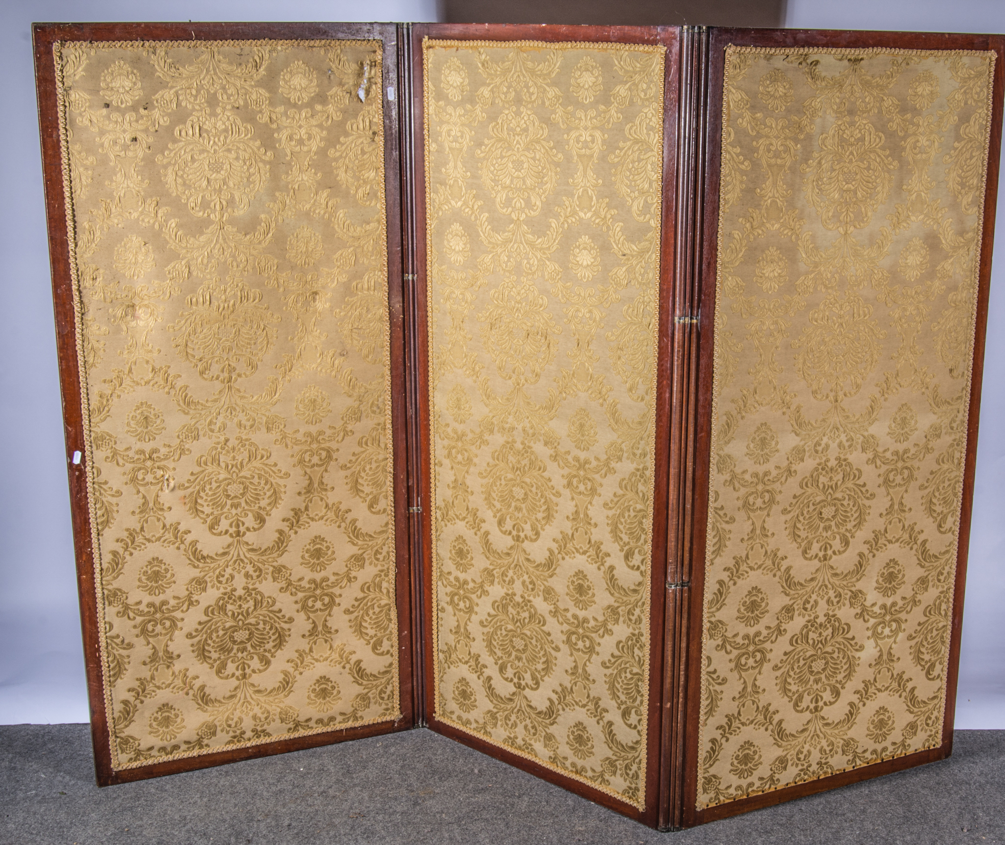 Mahogany framed three fold screen, fabric covered panels,