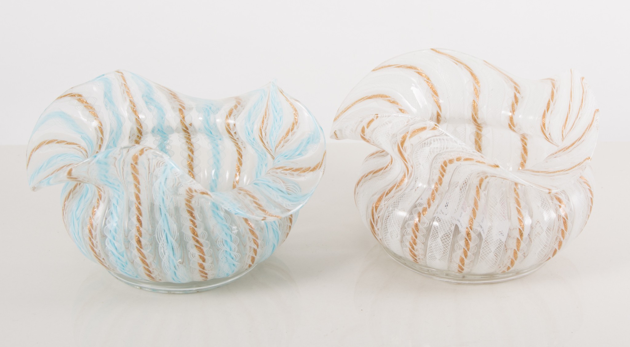 Pair of Venetian glass bowls, wavy rims, latticino with aventurine flecks, height 8cm.