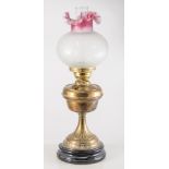 Brass pedestal oil lamp with tinted shade, base is broken.