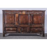 A joined oak mule chest, basically early 18th century, three-panel hinged lid,