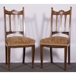 Set of four dining chairs, carved and pierced slats,