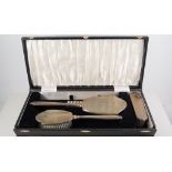 Silver backed dressing table set, hair brush, clothes brush, a hand mirror and comb,