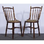 Six Victorian elm and beech dining chairs, turned and ringed frames, circular upholstered seats.