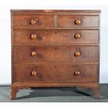 A 19th century oak chest of drawers on bracket feet, two short over three long,