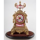 Late 19th century French gilt metal mantel clock, porcelain panels, enamelled with flowers, worn,