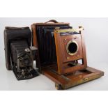 Mahogany and brass plate camera by Thornton Pickard, with lens plates and Kodak Eastman camera,