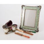 A pair of mother-of-pearl opera glasses in fitted case,