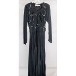 Seven black vintage cocktail and evening gowns,