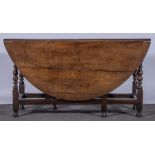 A joined oak gate-leg table, basically 18th century, oval top, turned legs, plain rails,