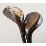 Two vintage left handed hickory shafted golf clubs - an early Spalding wooden headed club with