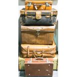 Tin trunk and suitcases.