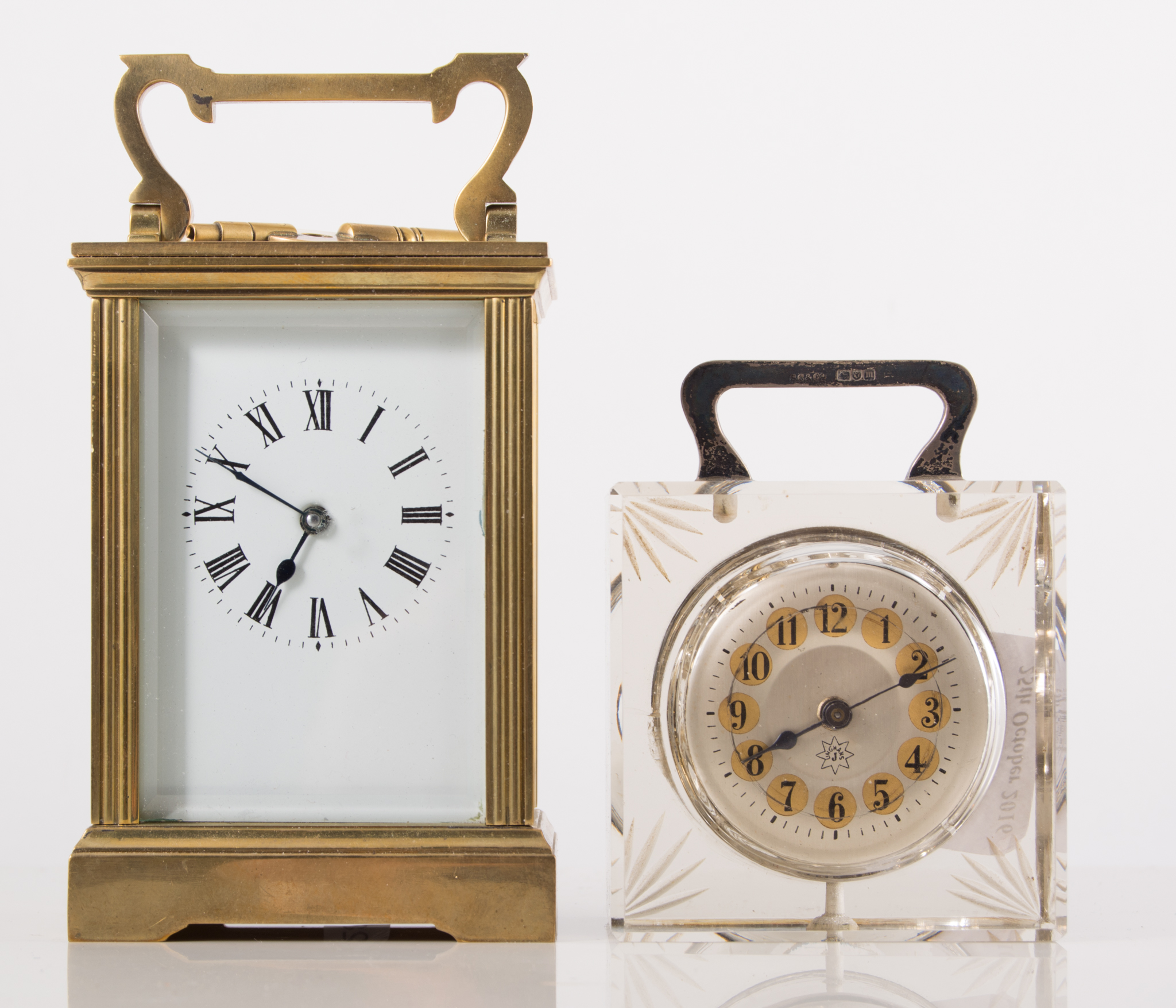 A French brass carriage clock, rectangular enamelled dial with Roman numerals,