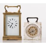 A French brass carriage clock, rectangular enamelled dial with Roman numerals,