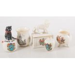 A collection of Goss and other similar ceramic souvenirs, railway wagon, black cat, etc.