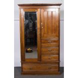 An Edwardian walnut combination wardrobe, width 116cm, height 194cm.