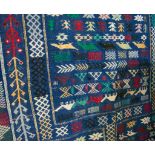 Berber rug, blue ground, geometric patterns, 132 x 228cm.