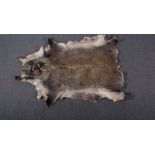 A full hide rug, approximately 236cm x 214cm, and two smaller hide rugs, (3).