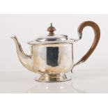 Silver teapot, circular body with reeded and leaf spray border on single round foot,