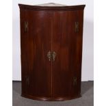 George III mahogany hanging bowfront corner cupboard, D50cm x H107cm.