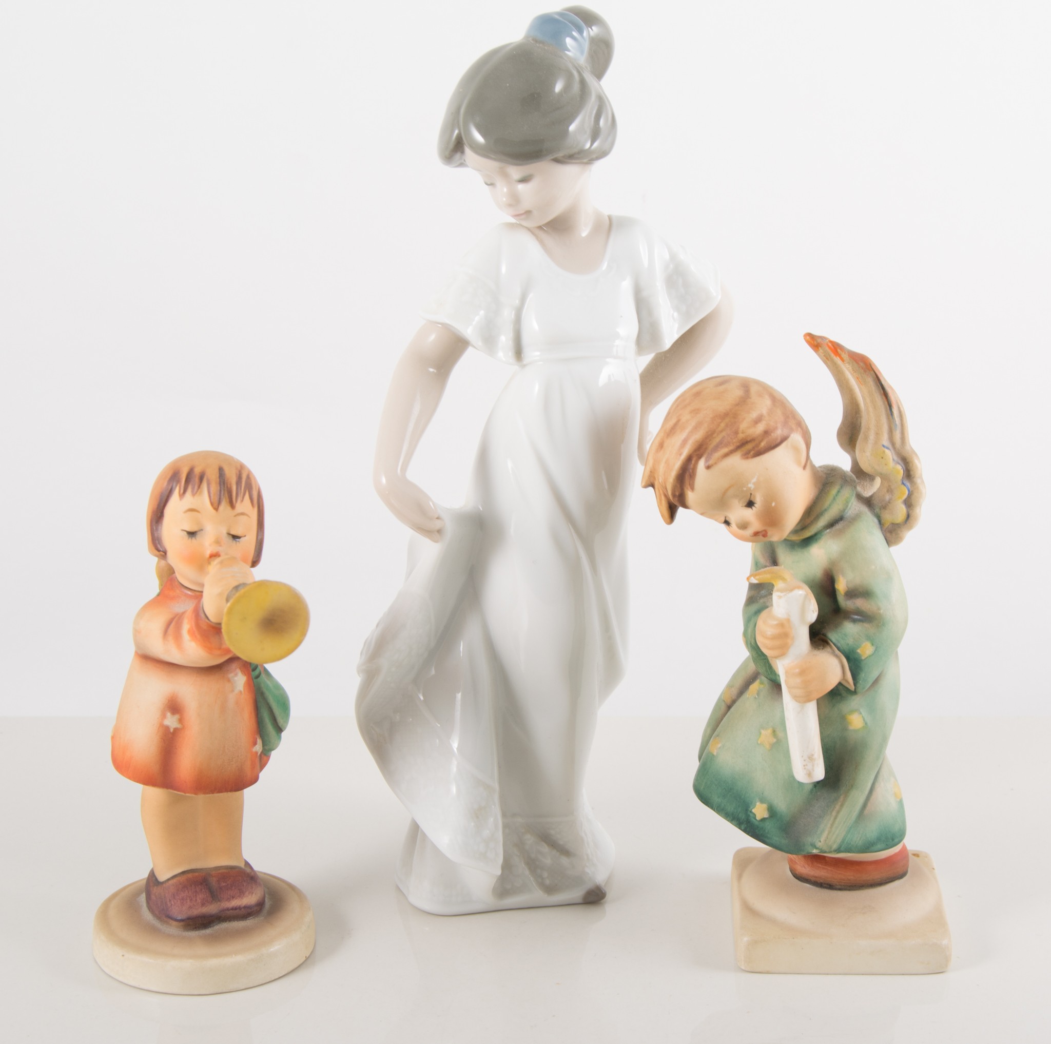 Nao figure of a girl, 54cm; and five Hummel figures, (6).