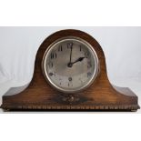 An oak Napoleon's hat mantel clock, Alba movement striking on five gongs,