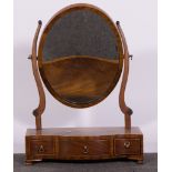 Victorian mahogany toilet mirror, oval adjustable plate, on scrolled supports,