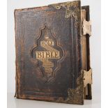 Two large antique family bibles, one with metal corner brackets, leather bound, (2).