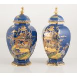 Pair of Carltonware powder blue covered vases, swollen octagonal form, 24.5cm high.