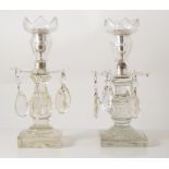 Pair of early 19th century cut glass table candlesticks with droplet skirts, square bases,