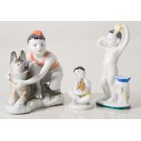 Four Lomonosov porcelain figures, including boy and dog group, boy washing, boy with towel,